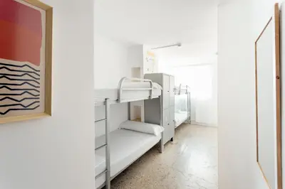 a small room with bunk beds in it at Casa Jam Barcelona in Barcelona