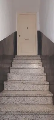a set of stairs with a door in the background at Mediterranien Terrace in Calella