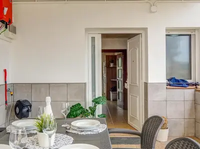 a dining room with a table and chairs at Villa Papallona by Hello Homes Sitges in Sant Pere de Ribes