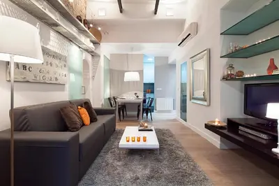 a living room with a couch and a table at Cathedral Apartment in Barcelona