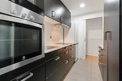 a kitchen with a sink and a stove at Bright 3BR2BA w Balcony in Eixample in Barcelona
