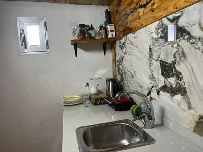 a kitchen with a sink and a counter top with a sink at Casa kintsugi in Masquefa