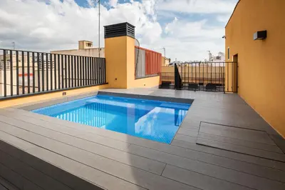 a swimming pool on the balcony of a building at CATERINA Santa Mònica in Barcelona