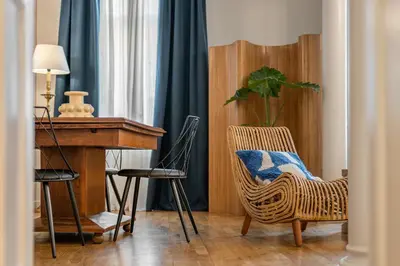 a room with a desk and a chair and a table at Balmes Apartment by Olala Homes in Barcelona
