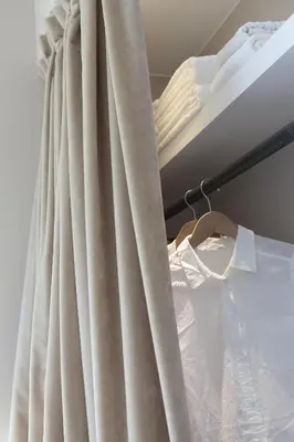 a curtain next to a bed in a room at Rambla 102 in Barcelona