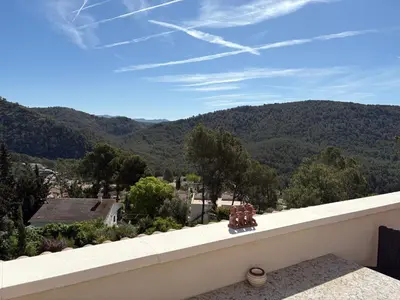 a view of the mountains from the balcony of a house at Olivella Bed&breakfast in Olivella