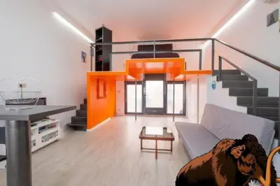 a living room with a couch and a dog in the middle at La casa del Mamut - Viladecans in Viladecáns
