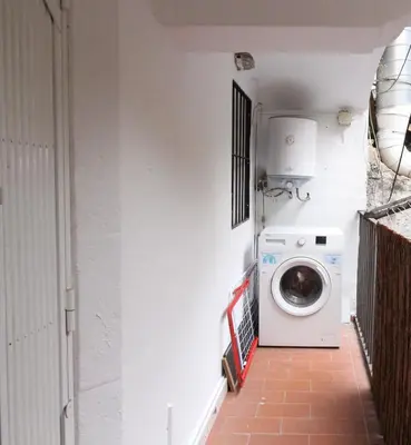 a laundry room with a washer and a washing machine at New design apartment in Barcelona center. in Barcelona