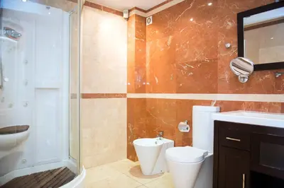 a bathroom with a shower and a toilet and a sink at Splendid Gaudi Mercat del Ninot Apartment in Barcelona