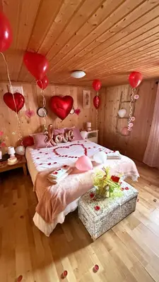 a room with a bed with hearts on the wall at Casita rural con piscina in La Torre de Claramunt
