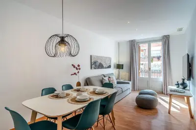 a living room with a table and chairs at 1520 - AB Eixample Sicília Apartment in Barcelona
