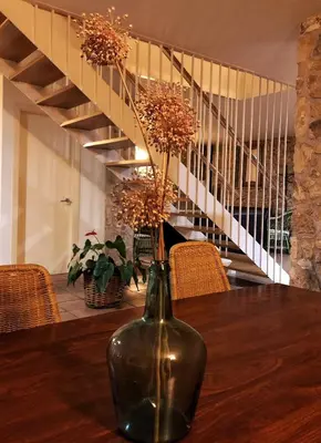 a vase sitting on top of a wooden table at Ca l'Helena in Castellet
