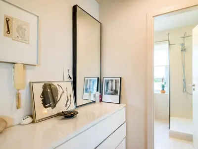 a bathroom with a counter with two mirrors and a sink at Loft Bouquet Alella mar y montaña 25 min a BCN in Alella