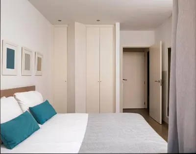 a living room with a couch and a table at Feelathome Plaza Apartments in Barcelona