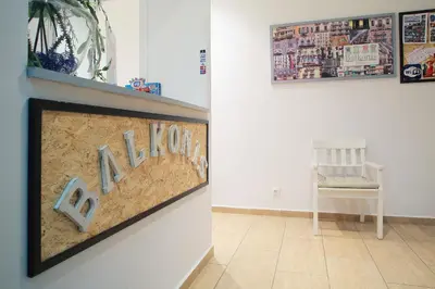 a picture on a wall with a chair in a room at Hostal Balkonis in Barcelona