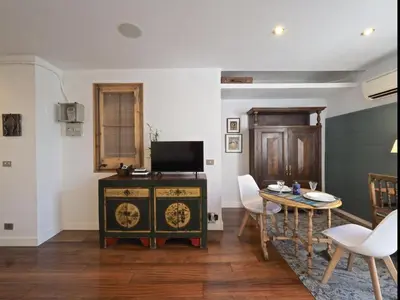 a living room with a table and a dining room at Apolo RoofTop Barcelona in Barcelona