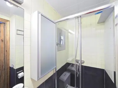 a bathroom with a glass shower and a toilet at Apolo RoofTop Barcelona in Barcelona