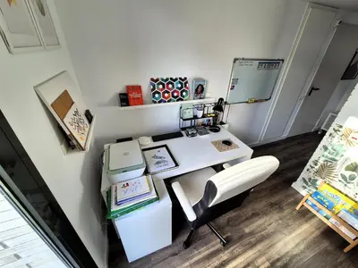 a office with a white desk and a chair at Casa Elena Maresme in Mataró