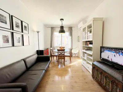 a living room with a couch and a table at Casa Sagrada Familia in Barcelona