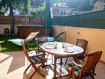 a table and chairs sitting on a balcony with a table and chairs at Holiday Home Origin by Interhome in Olivella