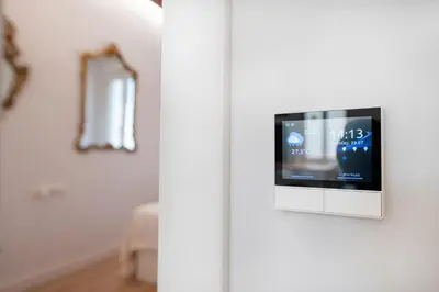 a television on a white door in a room at Ramblas Waterfront Stay in Barcelona