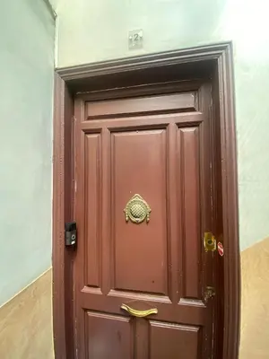 a brown door with a gold bow on it at Ramblas Waterfront Stay in Barcelona
