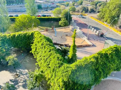 an overhead view of a park with trees and a street at Barca 5 NEW BEACH APARTMENT in Sant Adria de Besos