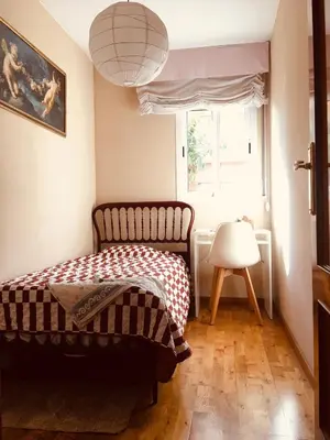 a bedroom with a bed and a window at Casa de Aurora in Rubí
