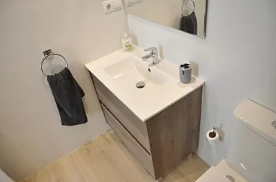 a bathroom with a sink and a toilet at Centro Sitges in Sitges