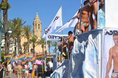 a group of people in bathing suits on a billboard at a beach at Centro Sitges in Sitges
