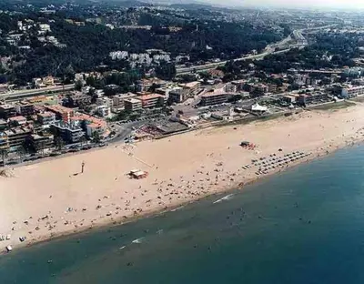 an aerial view of a beach with a group of people at Wonderful house near Barcelona in Castelldefels