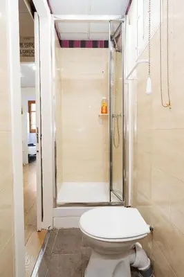 a bathroom with a toilet and a shower at Centric Apartments Sagrada Famila 3 in Barcelona