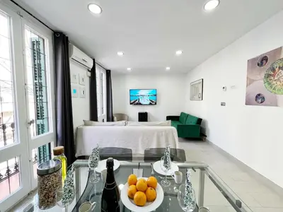 a room with a bed and a table with fruit on it at Sagrada Familia Gaudi in Barcelona