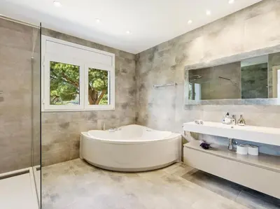 a bathroom with a tub and a sink and a mirror at Luxury Villa Buena Vista Pool and Garden in Arenys de Munt
