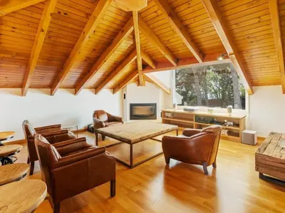 a large living room with a table and chairs at Luxury Villa Buena Vista Pool and Garden in Arenys de Munt