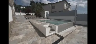 a swimming pool with a bench in a backyard at Villa Oasis entre Viñedos cerca de Barcelona con A A y piscina climatizada in Caserío de Caʼn Rosell