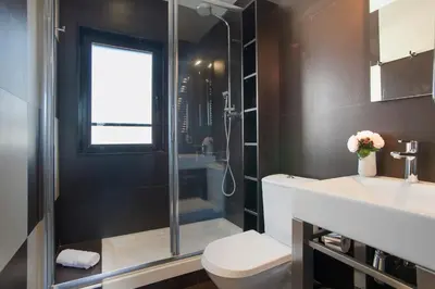 a bathroom with a shower and a toilet and a sink at Tendency Apartments 7 in Barcelona
