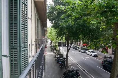 a balcony of a building with motorcycles parked on a street at Tendency Apartments 7 in Barcelona
