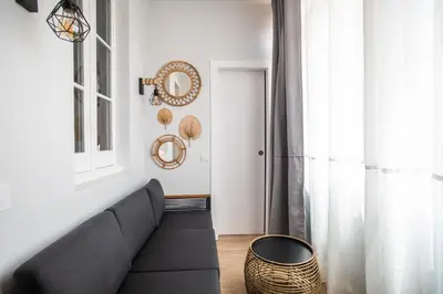 a living room with a couch and a table at Tendency Apartments Miro 6 in Barcelona