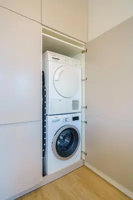 a washer and dryer in a laundry room at Sitges Spaces Mediterranean Penthouse in Sitges