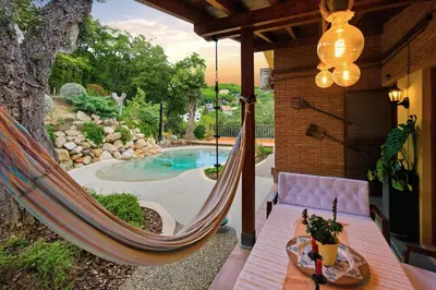 a living room with couches and a balcony at Fantástica casa con vistas al mar in Arenys de Munt