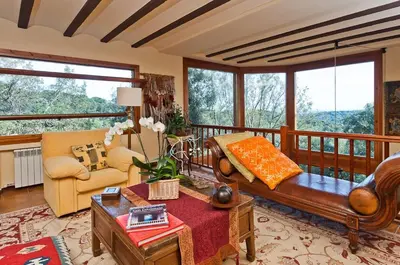 a living room with a couch and a table at Fantástica casa con vistas al mar in Arenys de Munt