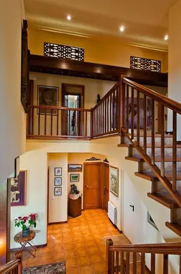 a large room with a staircase in a house at Fantástica casa con vistas al mar in Arenys de Munt