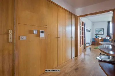 a room with a wooden wall with switches on it at Alcam Vila Olímpica in Barcelona