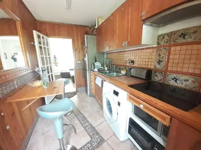 a kitchen with a sink and a stove top oven at Maresme´s corner in Sant Andreu de Llavaneres
