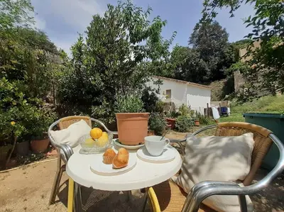 a white table with a bowl of food on it at Maresme´s corner in Sant Andreu de Llavaneres