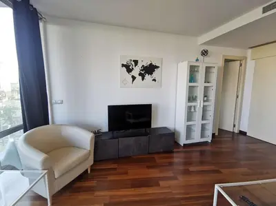 a living room with a couch and a television at Ral48 in Sant Adria de Besos