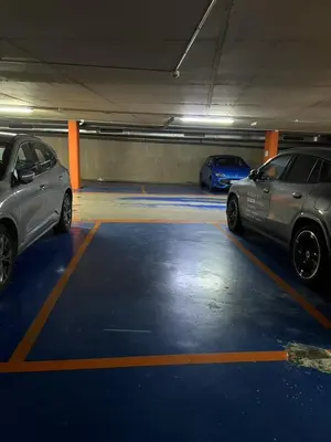 two cars are parked in a parking garage at Ral48 in Sant Adria de Besos