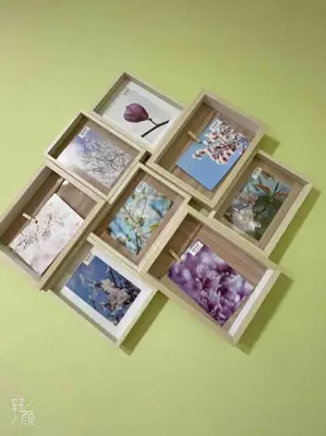 a group of wooden boxes filled with pictures of flowers at Loft nearby Sagrada Familia in Barcelona