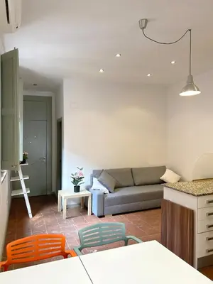 a living room with a couch and a table at SC Apartamento céntrico con balcón in Terrassa